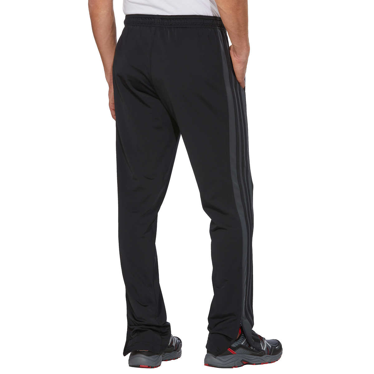 Adidas track pants with iconic side stripes – أنايــيــس
